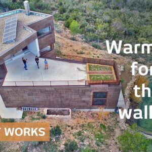 Cork-clad home uses thermal wall & circular vents as free A/C