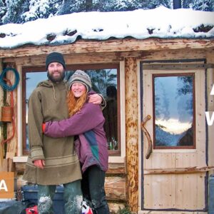 Young couple winter preps in self-built remote Alaska cabin