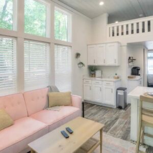 Sweet Natured Nesthaven Tiny Home with Pink Sofa and Cozy Deck