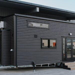 Possibly The Coziest Black Kingfisher Tiny House in NZ